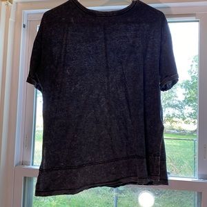 Small dark gray shirt made from cotton.